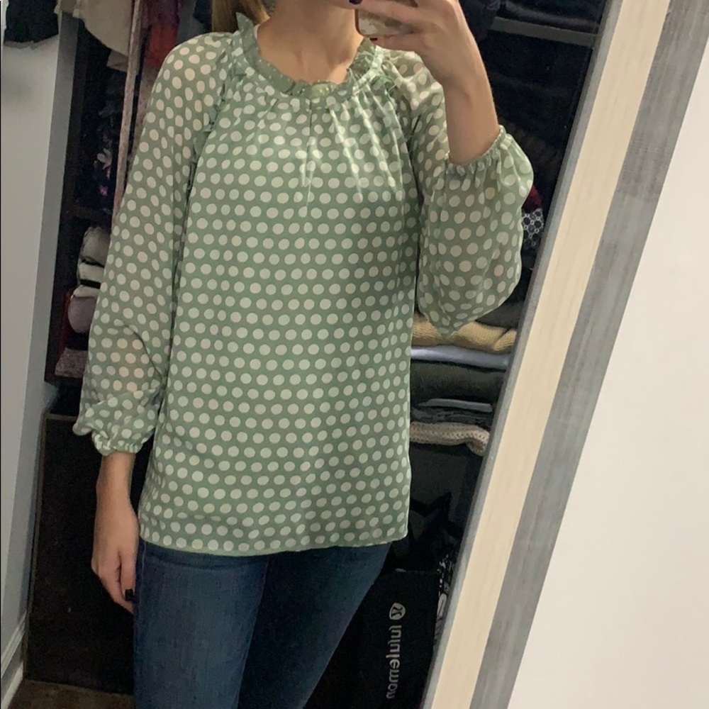 Green and white polka dot blouse